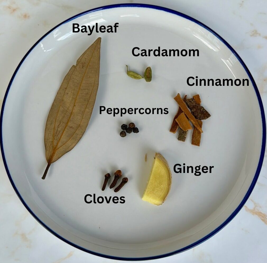 Bayleaf, cloves, cardamom, cinnamon, peppercorns, ginger