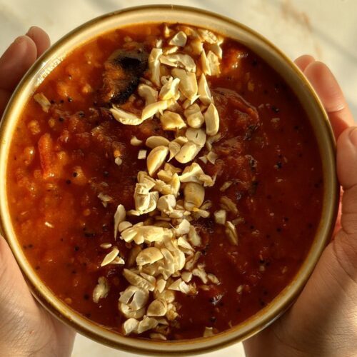 Tomato chutney in small plate with cashew nuts