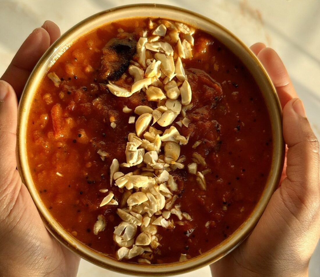 Tomato chutney in small plate with cashew nuts