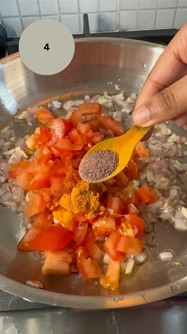 black salt being added to pan