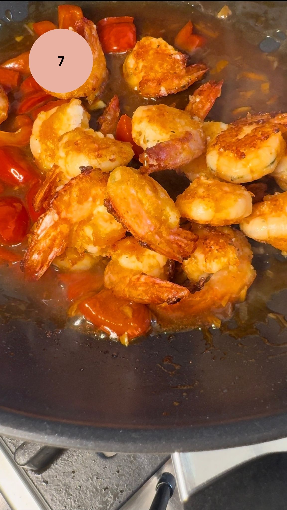 fried prawns added to wok