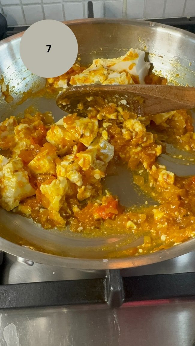 silken tofu being broken up with spoon