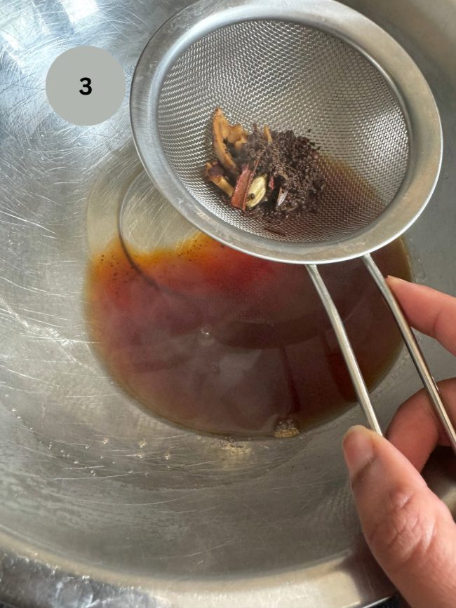 tea being strained out into a bowl