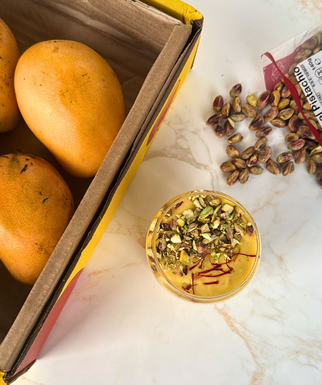 lassi with box of mangoes and pistachios