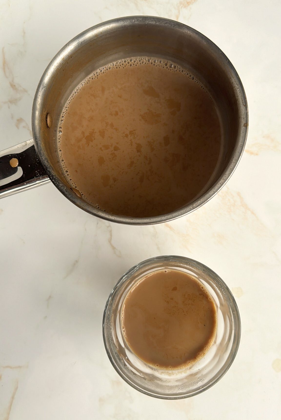 masala chai in saucepan and in glass