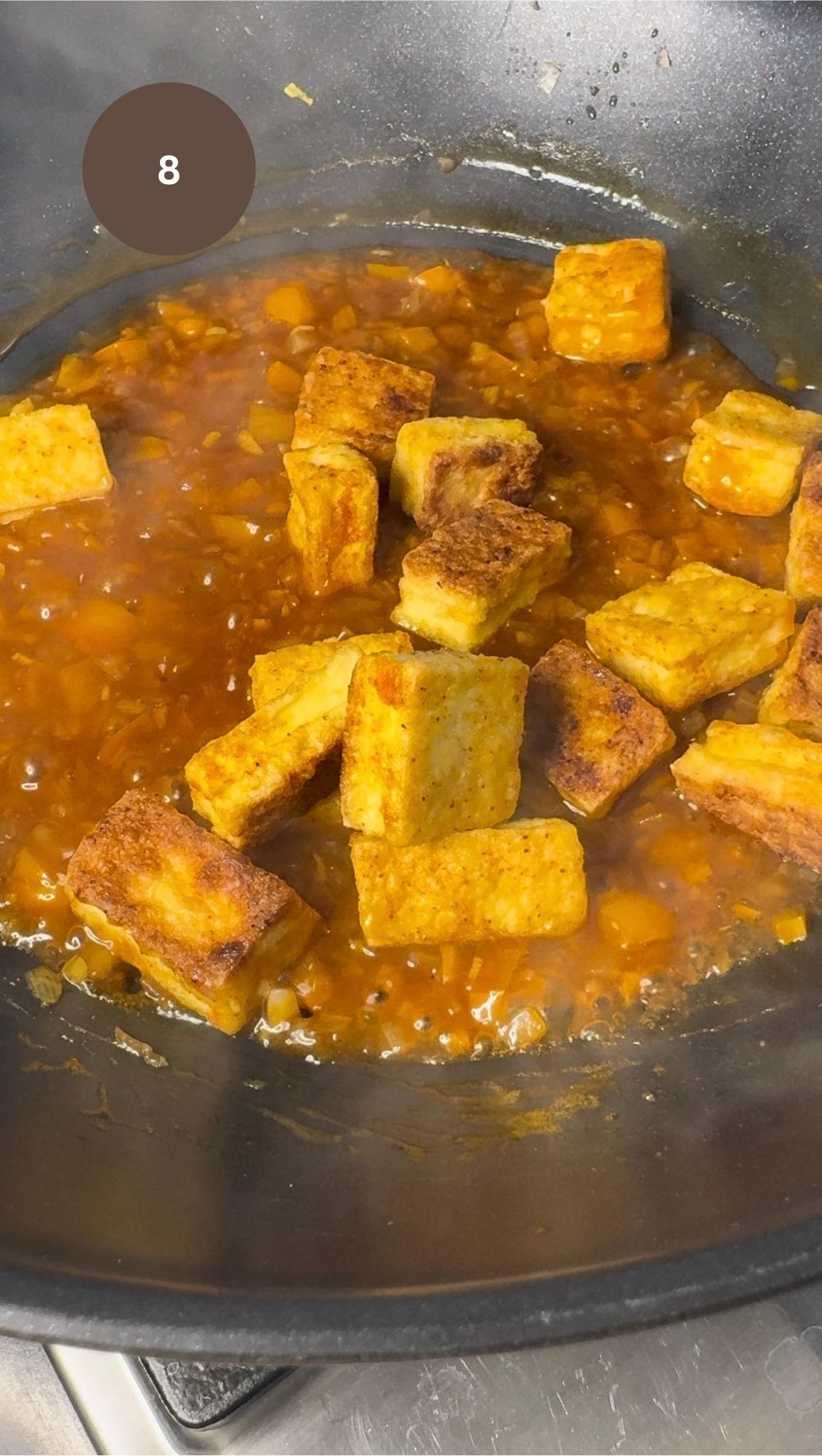 pan fried crispy tofu added to wok