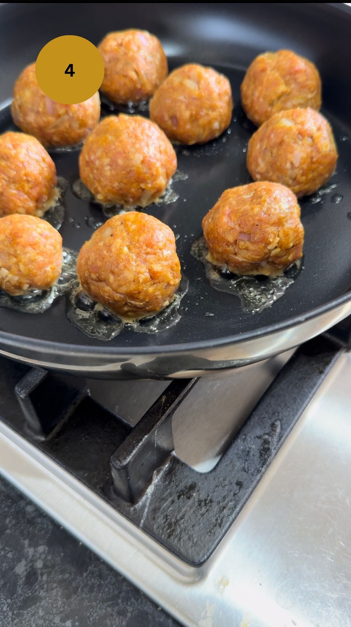 lamb mince balls in fry pan with oil