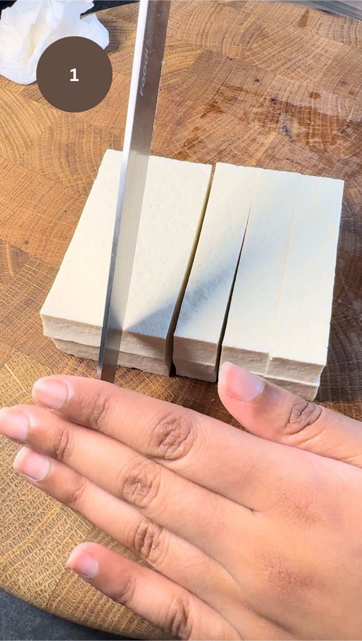 knife cutting block of tofu