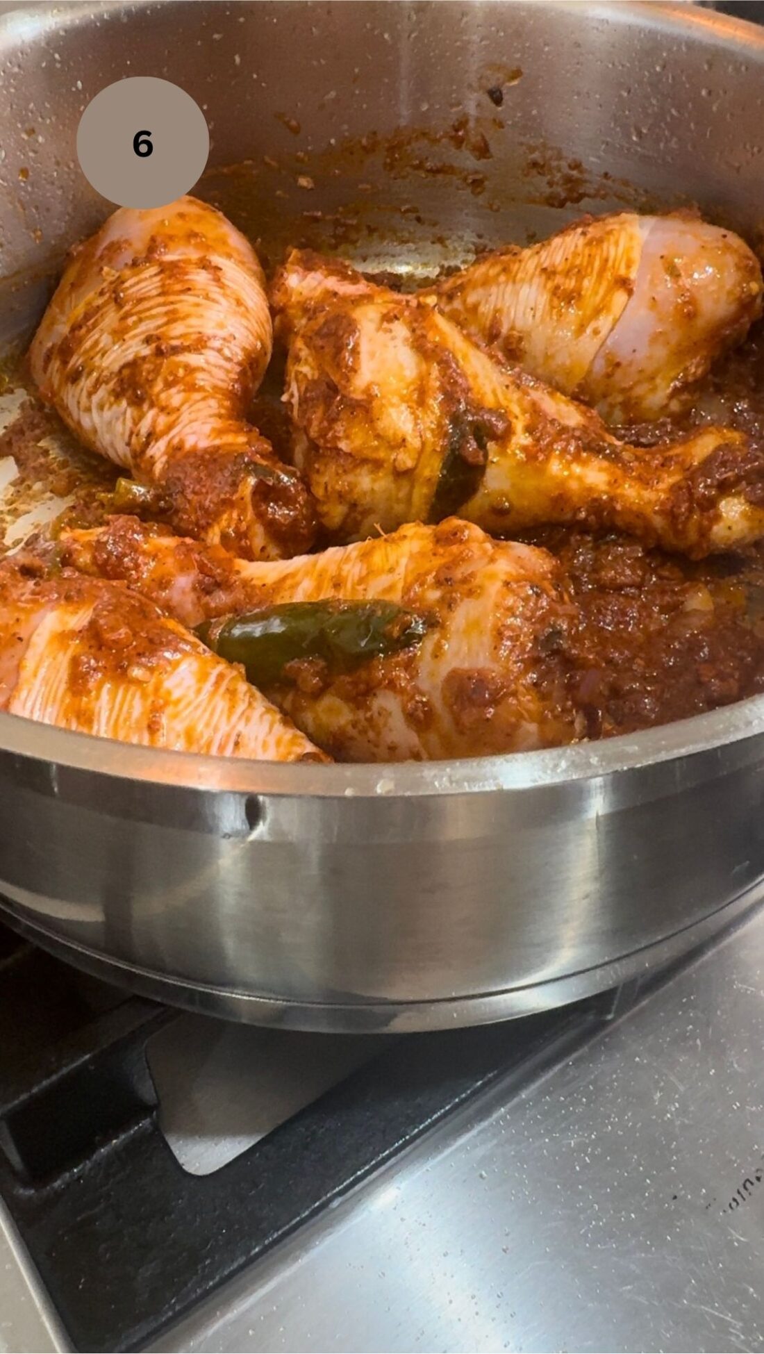 chicken drumsticks added and mixed in well to the spice mix