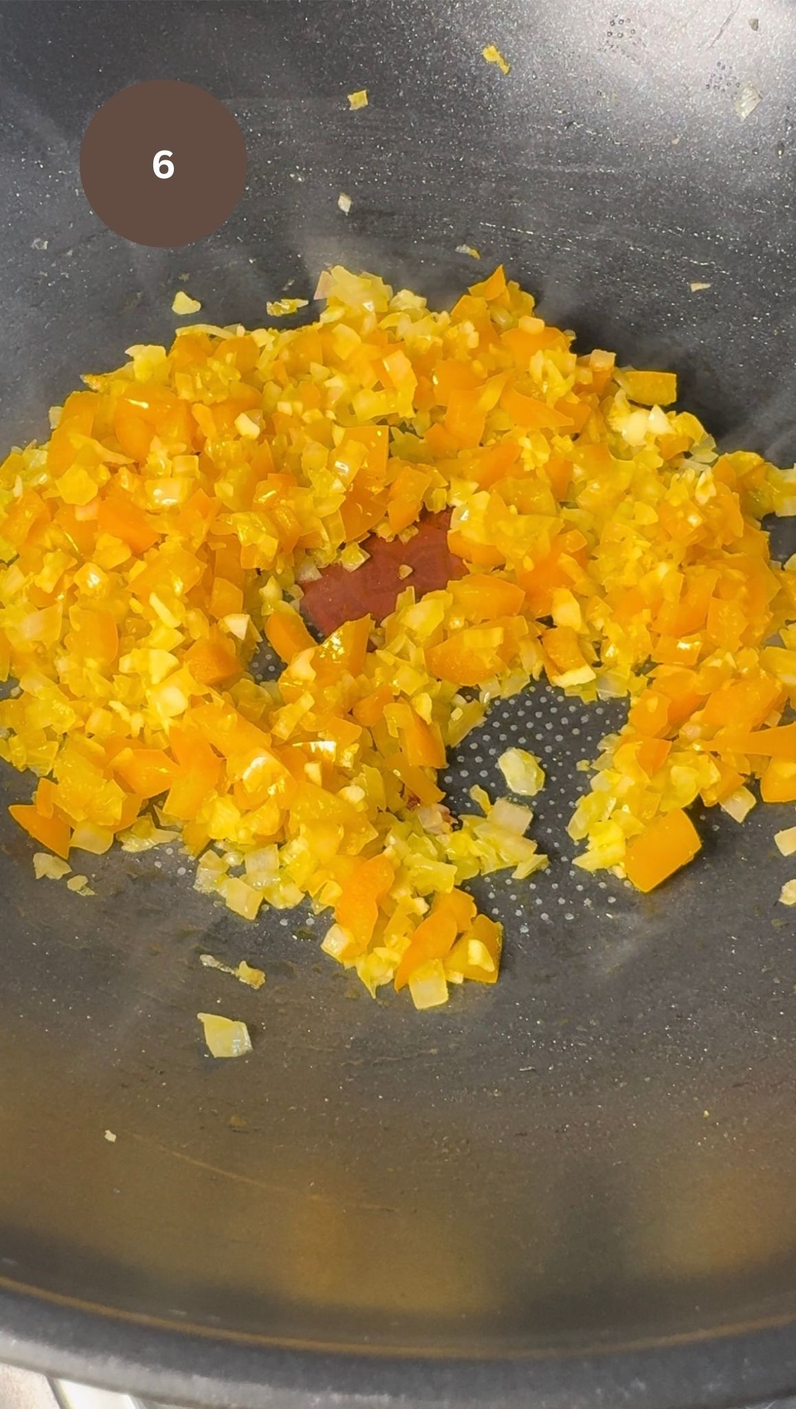 onions, garlic and peppers frying together in wok