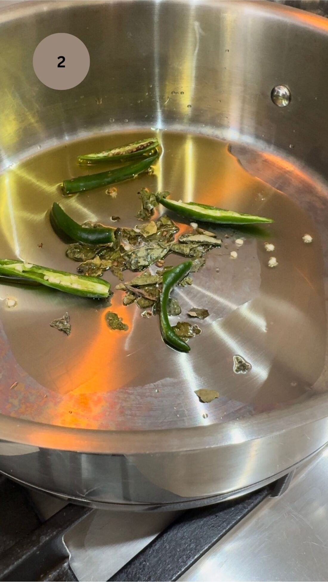 curry leaves and green chillis frying