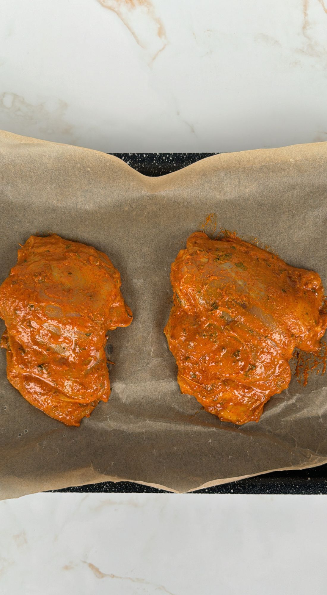 chicken thighs resting on baking tray