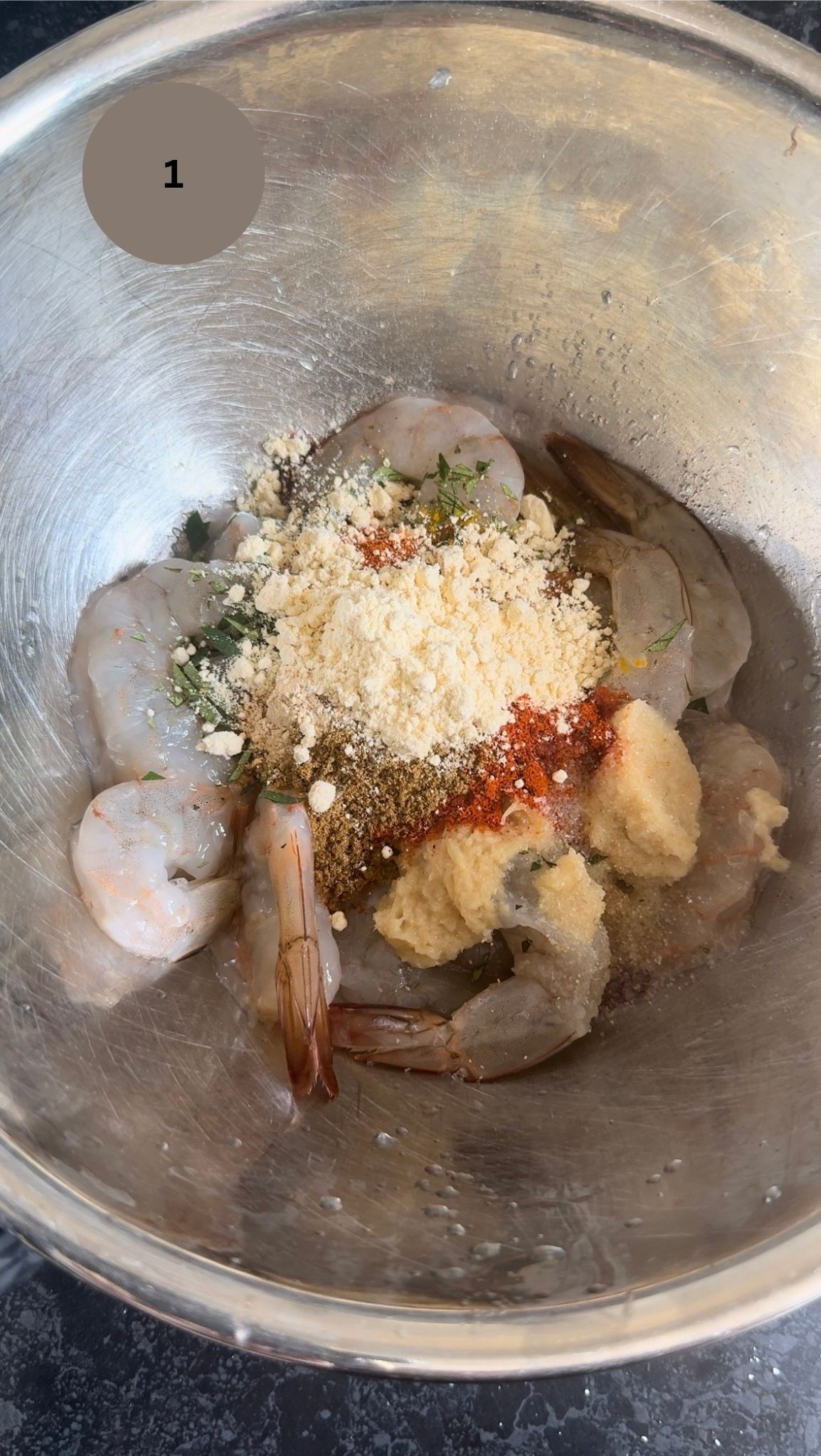 prawns in steel bowl with all marination added