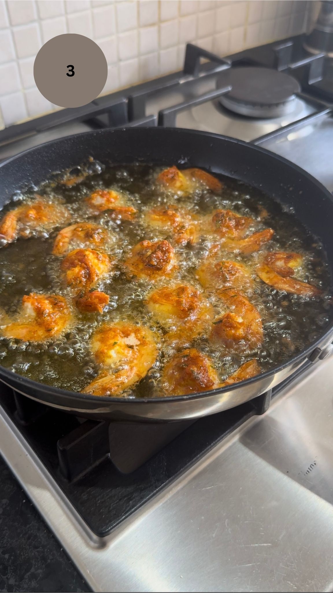 Prawns being shallow fried